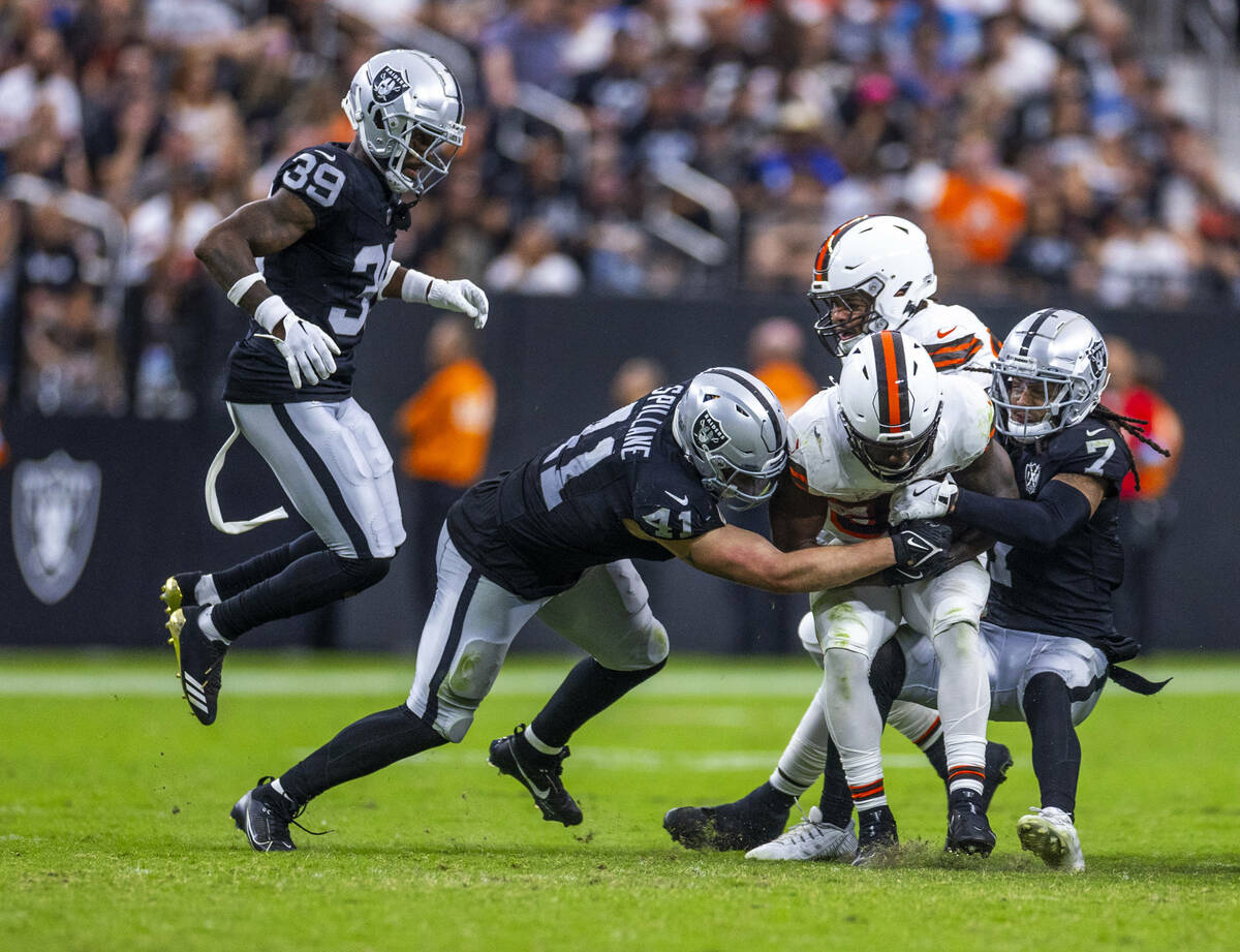 Cleveland Browns running back Jerome Ford (34) is stopped short of a first down by Raiders safe ...