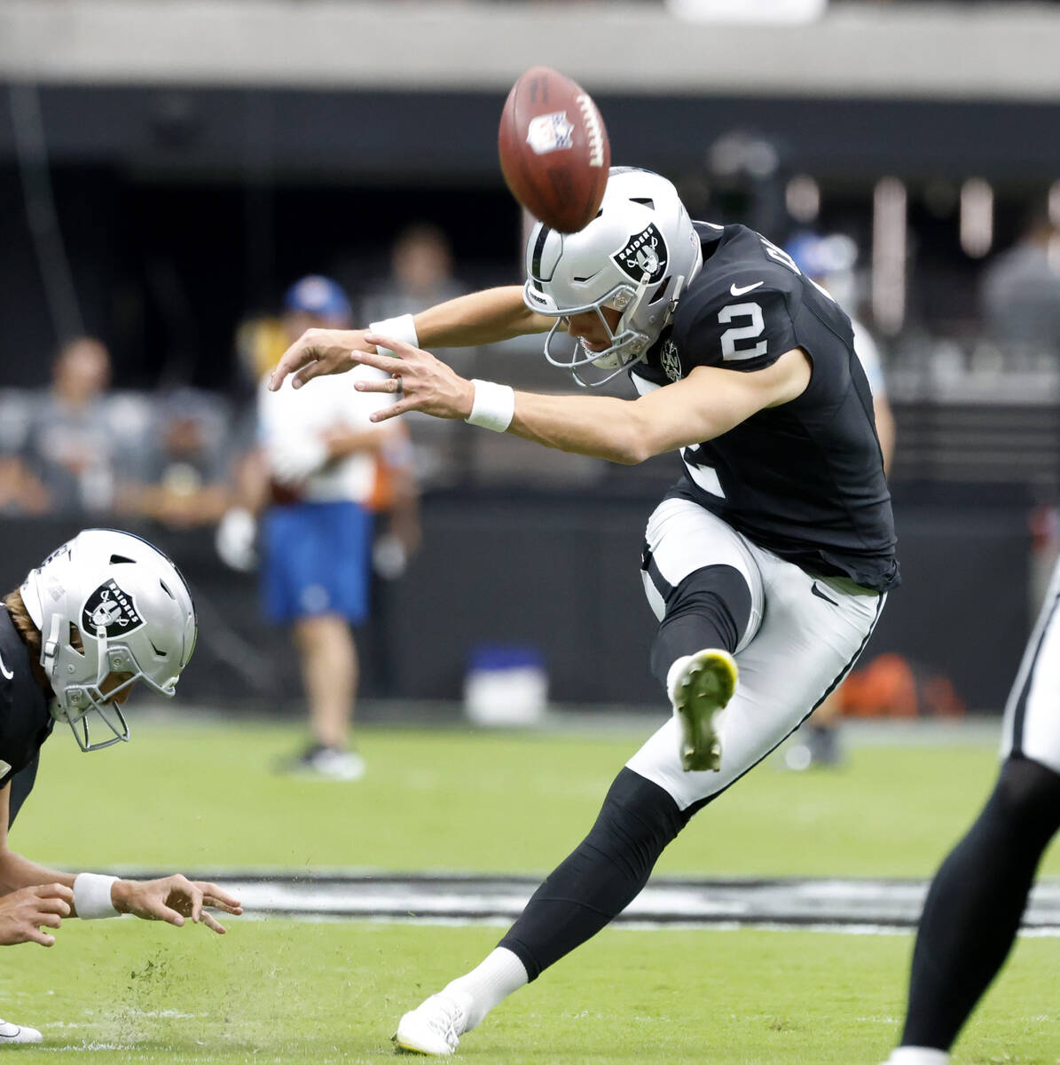 Raiders place kicker Daniel Carlson (2) kicked the ball before an NFL game against the Clevelan ...