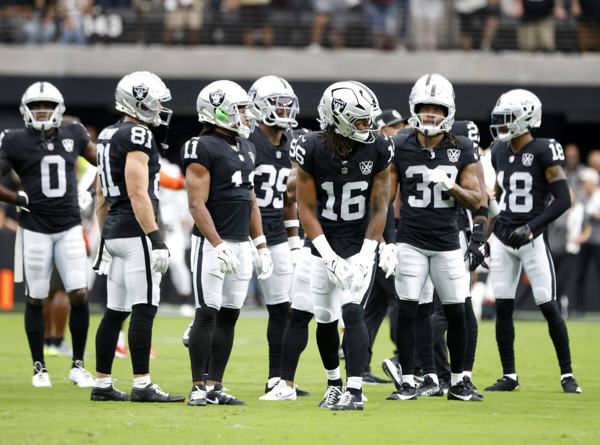 Raiders players prepare to warm up before an NFL game against the Cleveland Browns at Allegiant ...