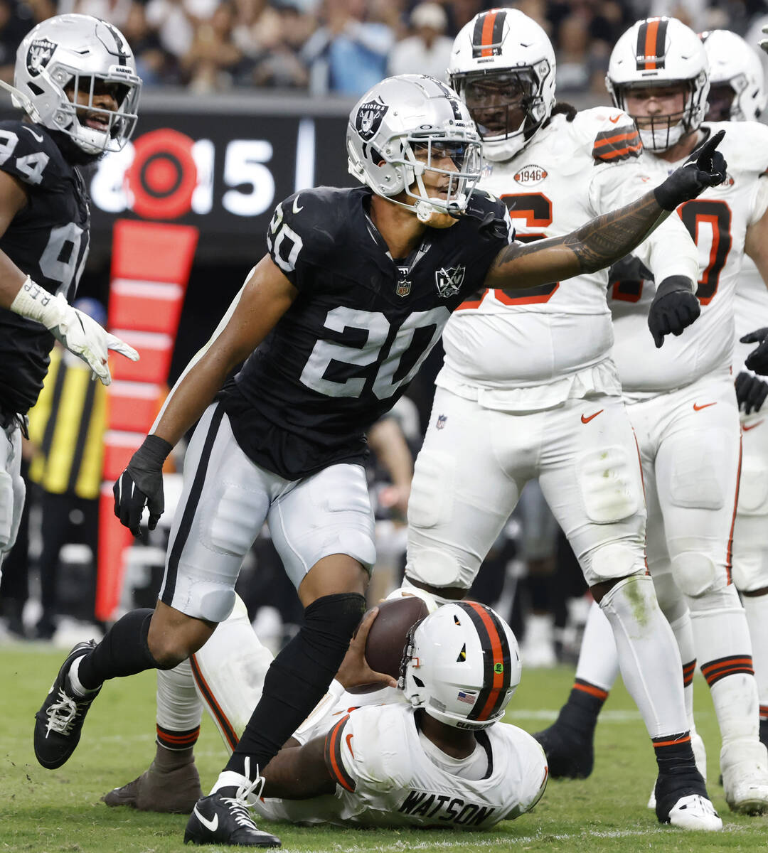 Raiders safety Isaiah Pola-Mao (20) reacts after sacking Cleveland Browns quarterback Deshaun W ...