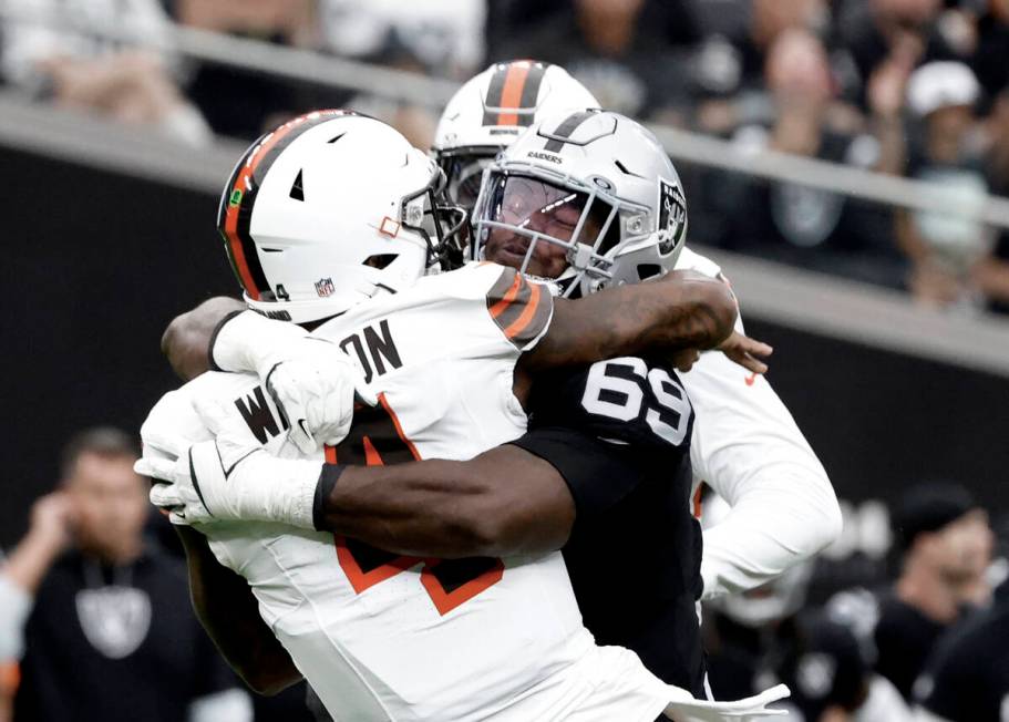 Raiders defensive tackle Adam Butler (69) sacks the Cleveland Browns quarterback Deshaun Watson ...