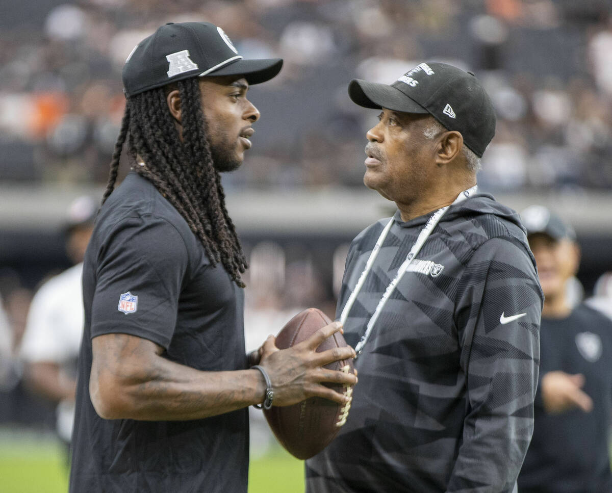 Raiders wide receiver Davante Adams, left, with former Raiders defensive back George Atkinson b ...