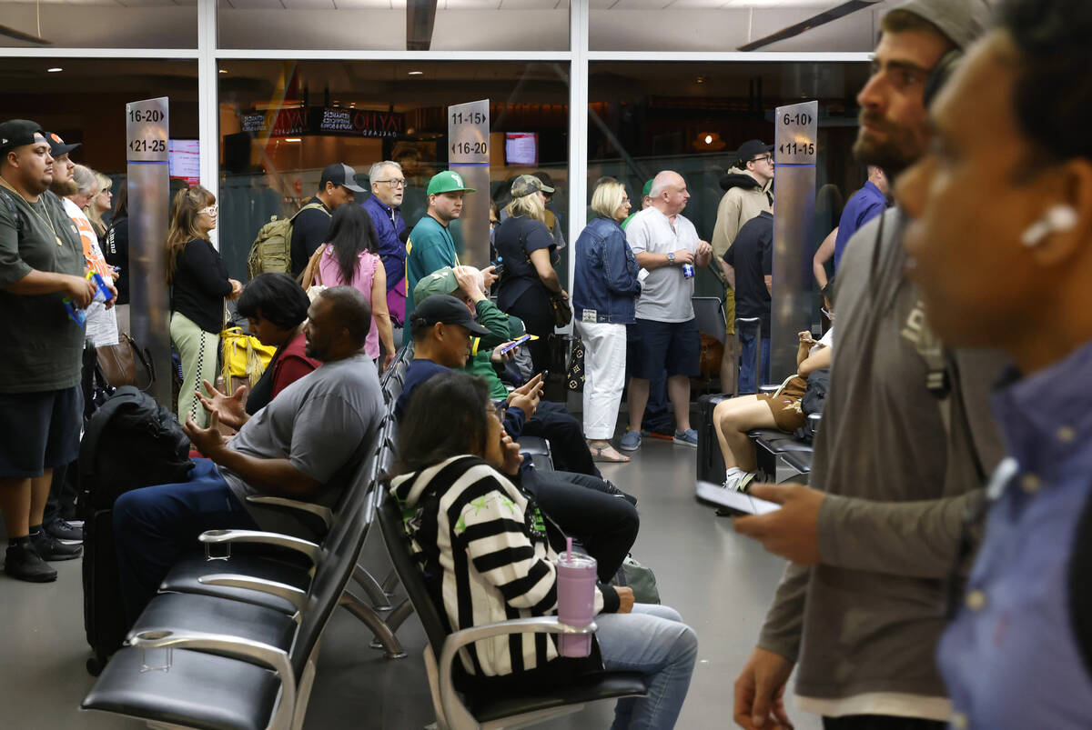 Passengers line up based on boarding group numbers to board a Southwest Airlines flight at Oakl ...