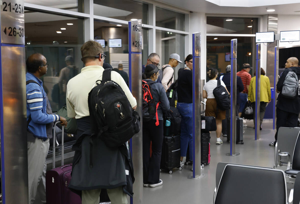 Passengers line up based on boarding group numbers to board a Southwest Airlines flight at Oakl ...