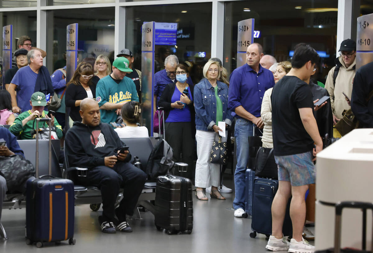 Passengers line up based on boarding group numbers to board a Southwest Airlines flight at Oakl ...