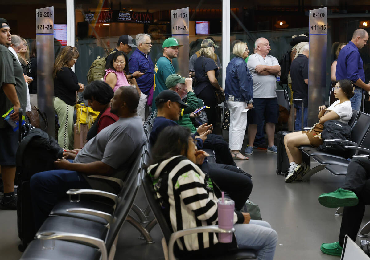 Passengers line up based on boarding group numbers to board a Southwest Airlines flight at Oakl ...