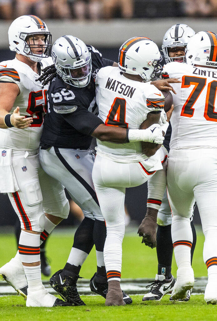 Raiders defensive tackle Nesta Jade Silvera (99) gets to Cleveland Browns quarterback Deshaun W ...