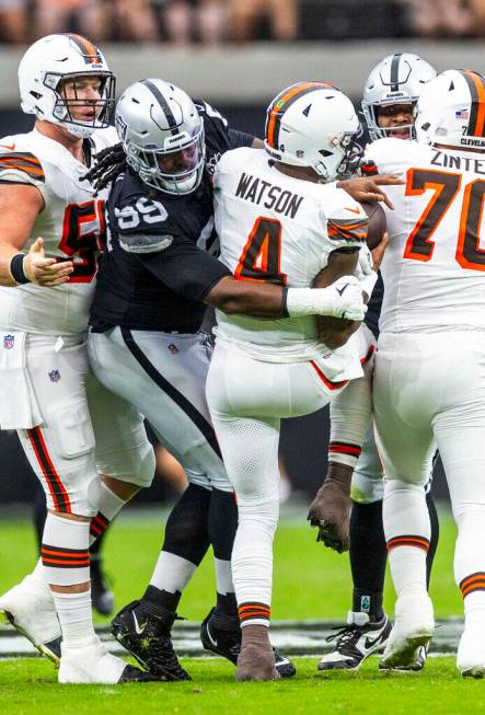 Raiders defensive tackle Nesta Jade Silvera (99) gets to Cleveland Browns quarterback Deshaun W ...