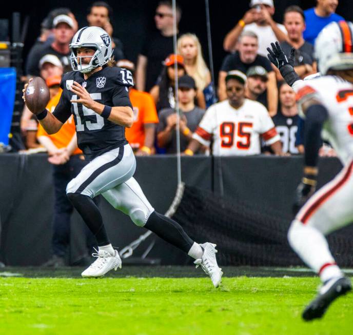 Raiders quarterback Gardner Minshew (15) looks for a pass against the Cleveland Browns during t ...