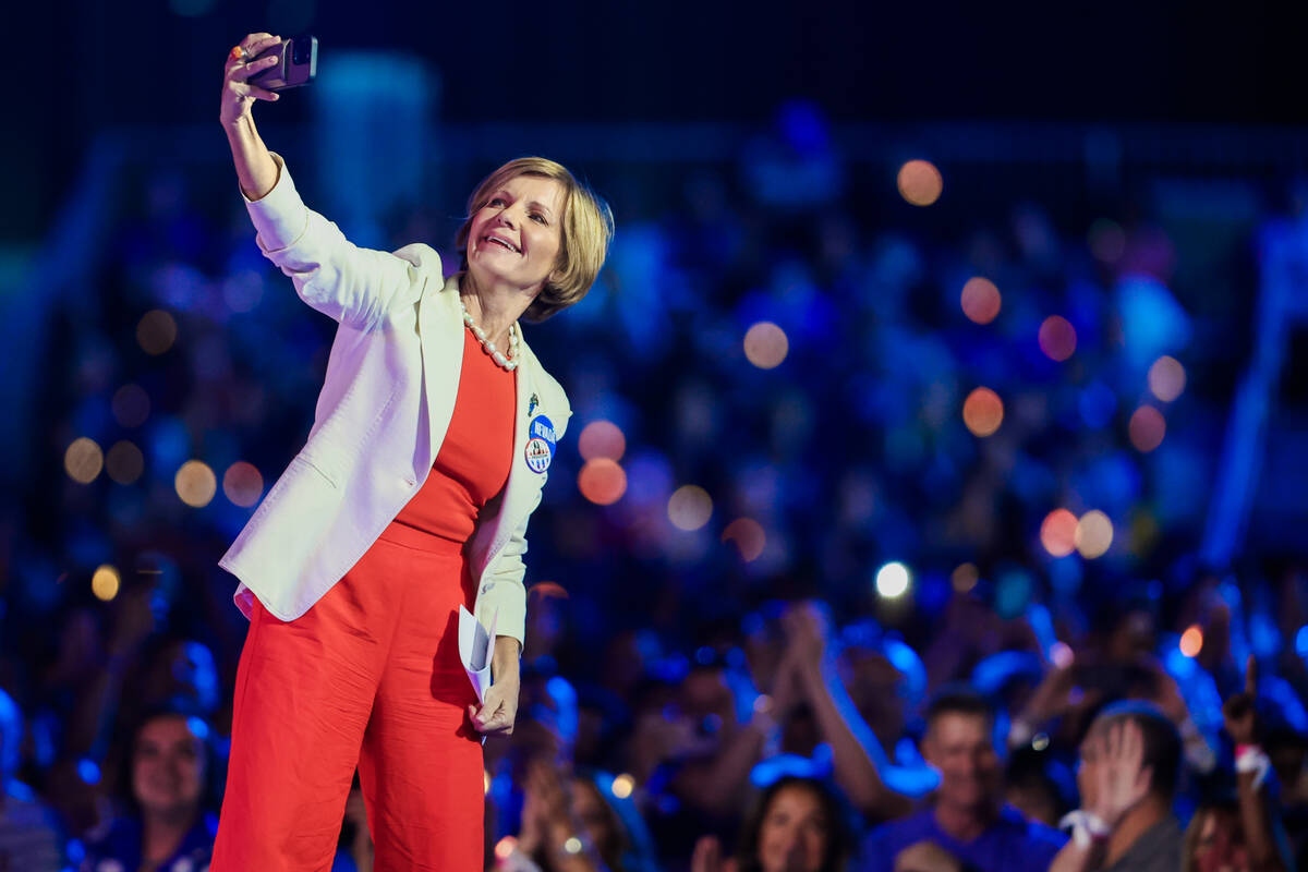 Rep. Susie Lee, D-Nev., takes a selfie with the crowd during a campaign event for Democratic pr ...