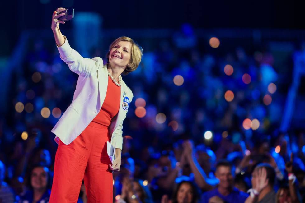 Rep. Susie Lee, D-Nev., takes a selfie with the crowd during a campaign event for Democratic pr ...