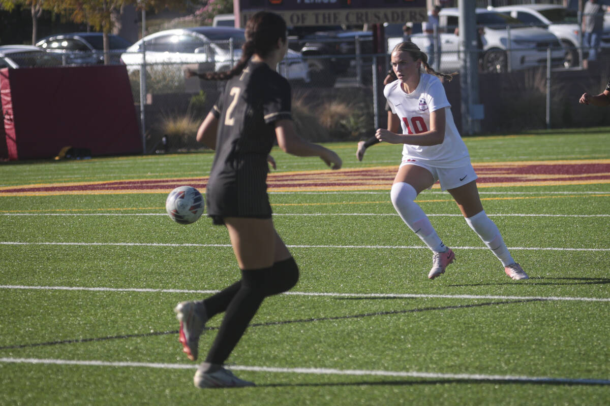 Coronado's Ryan Neel (10) brings the ball up the field during a soccer game at Faith Lutheran H ...