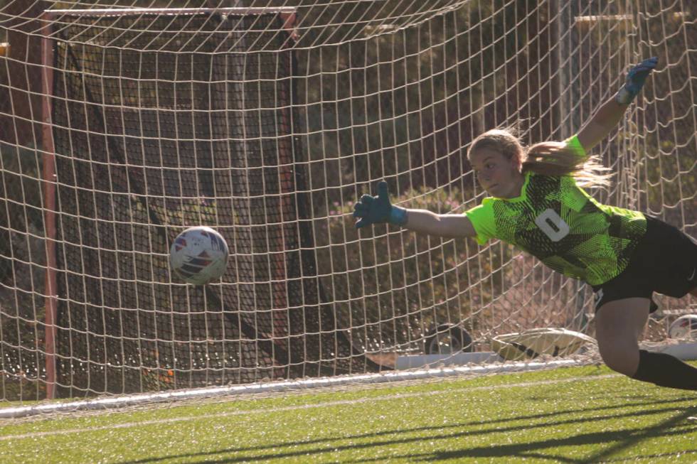 Coronado's goalkeeper Liliana Foss (0) jumps for the ball as it misses the net during a soccer ...