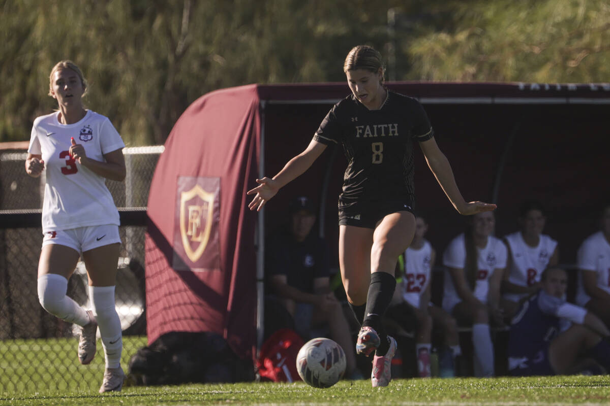 Faith Lutheran's Olivia Stark (8) brings the ball up the field against Coronado during a soccer ...