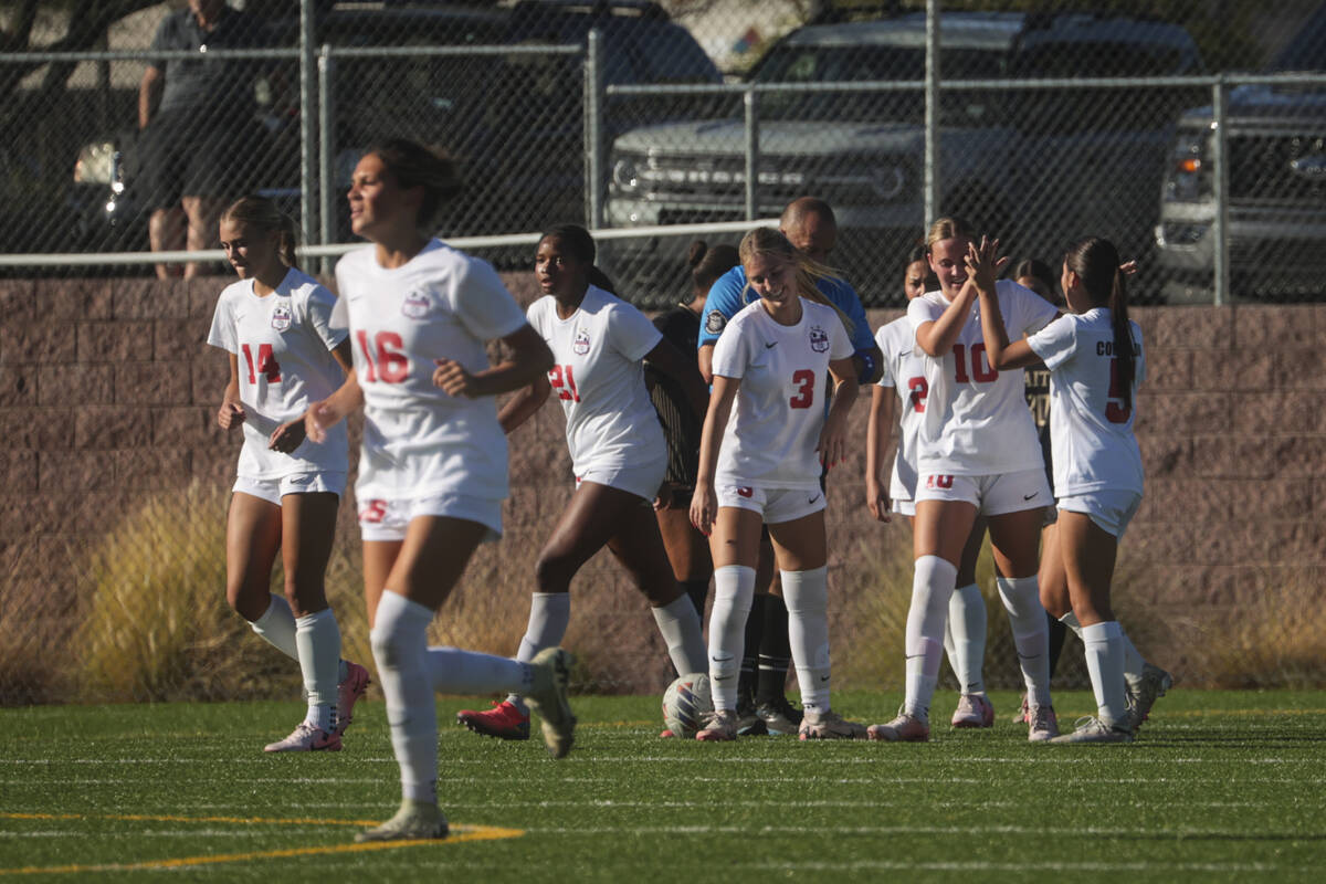 Coronado's Ryan Neel (10) celebrates her goal with teammates during a soccer game at Faith Luth ...