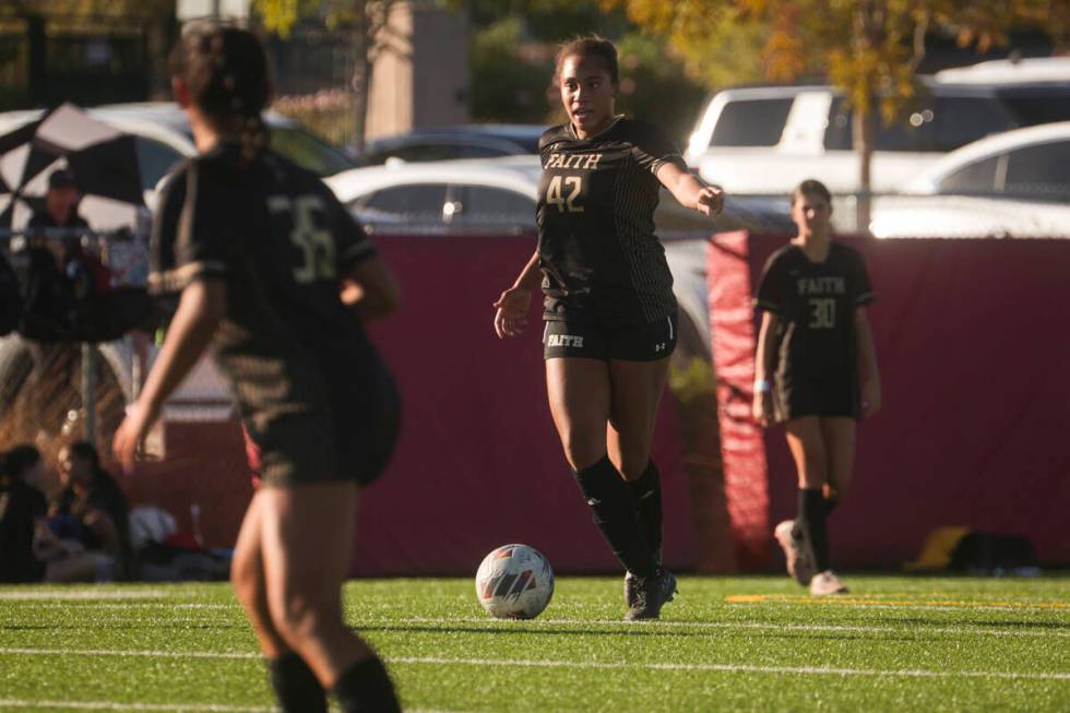 Faith Lutheran's Jailynn Henry (42) motions to teammates while playing against Coronado in a so ...