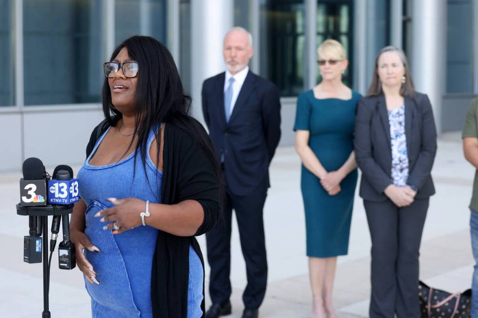 Iva Lewis, parent of a non-verbal autistic 3rd grader, speaks during a press conference at the ...