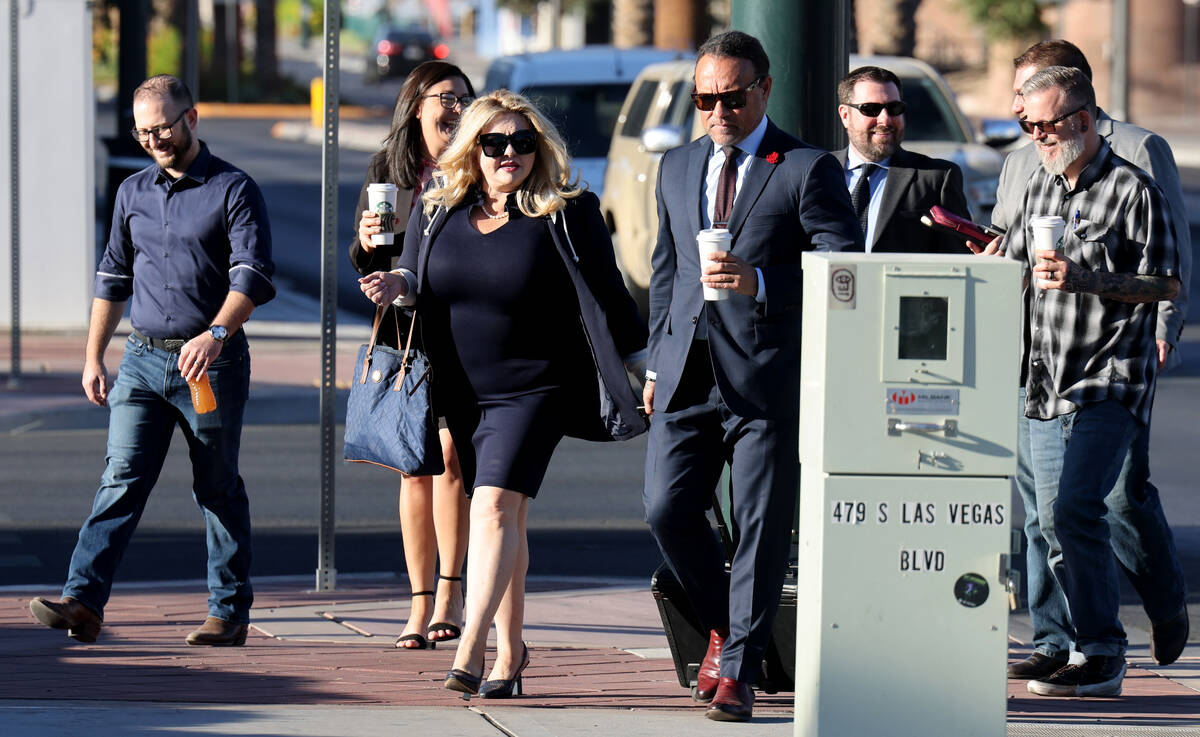 Former Las Vegas Councilwoman Michele Fiore, third from left, arrives for her wire fraud trial ...