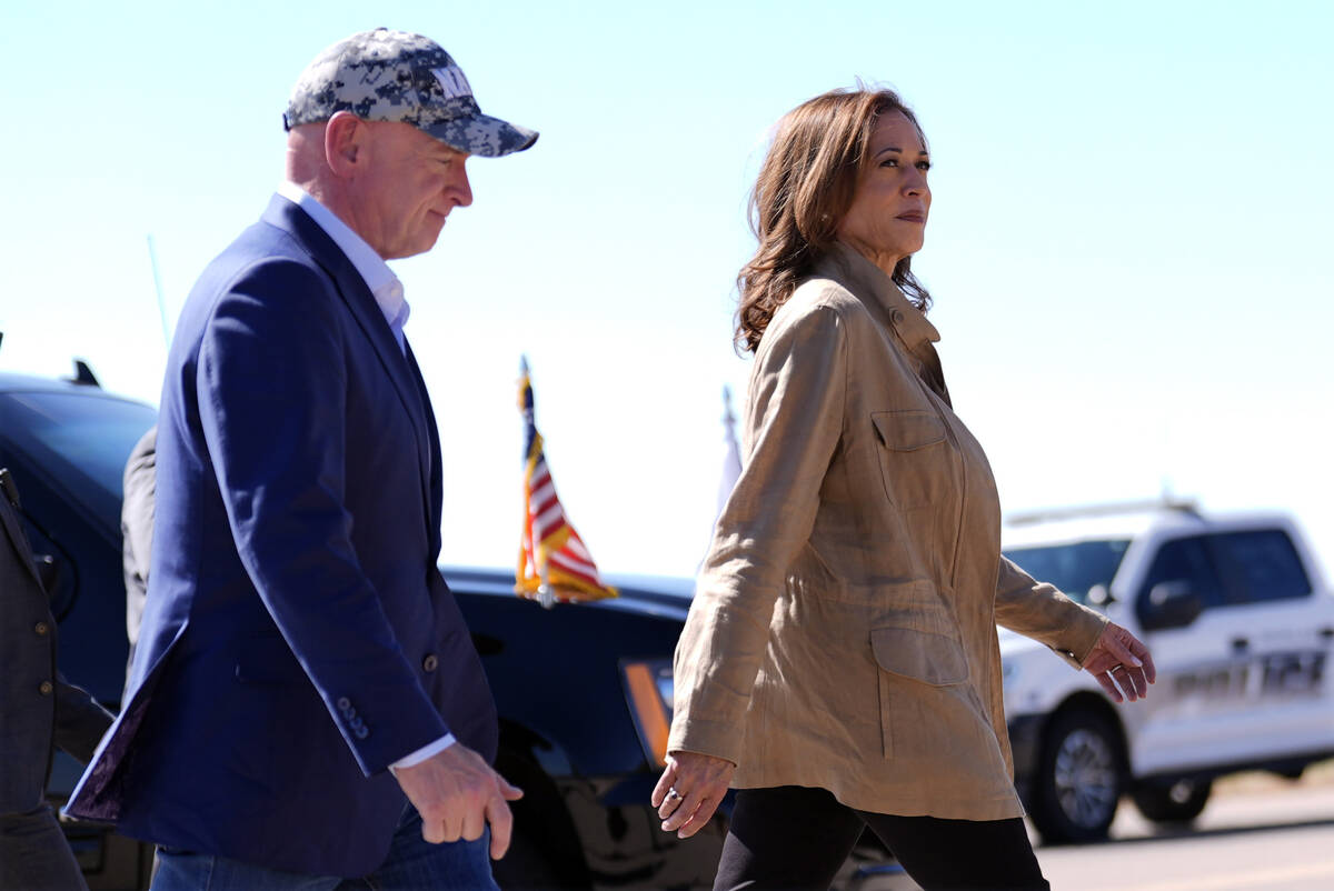 Democratic presidential nominee Vice President Kamala Harris followed by Sen. Mark Kelly, D-Ari ...