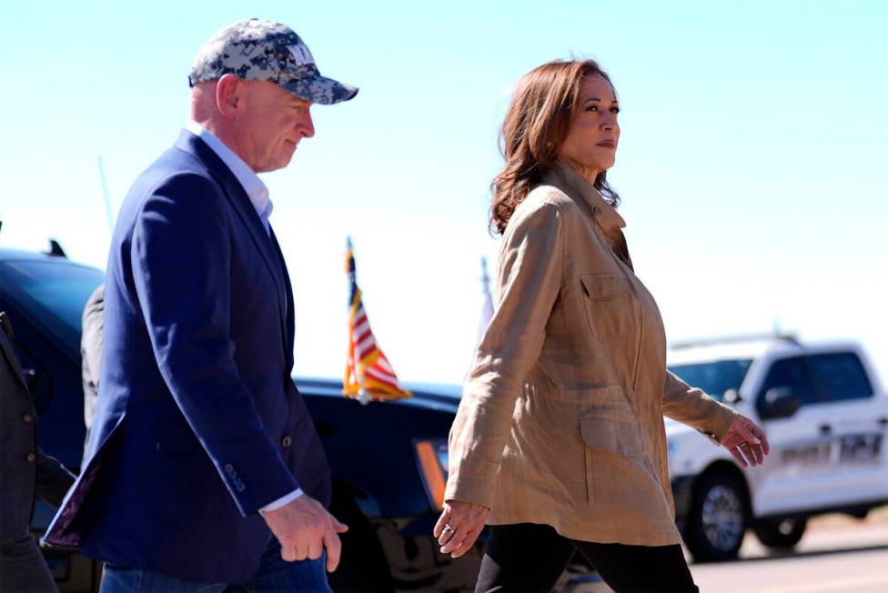 Democratic presidential nominee Vice President Kamala Harris followed by Sen. Mark Kelly, D-Ari ...