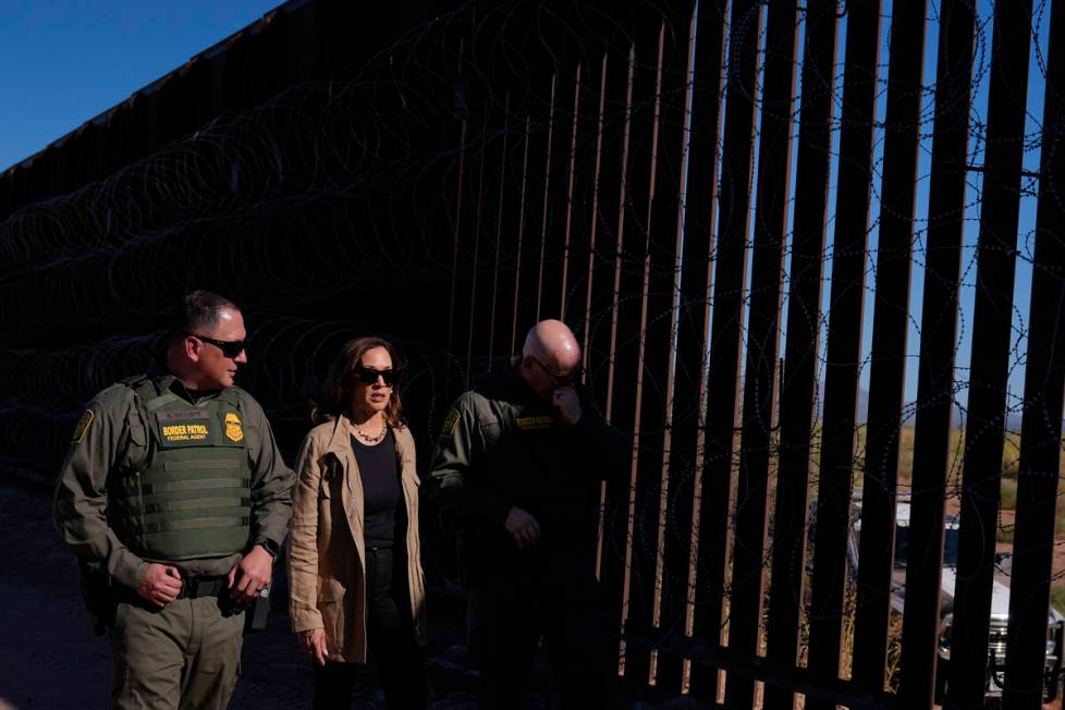 Democratic presidential nominee Vice President Kamala Harris talks with John Modlin, the chief ...