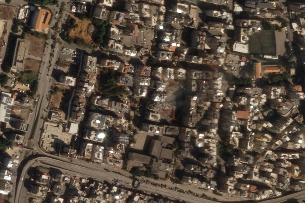 This satellite image from Planet Labs PBC shows the site of an Israeli airstrike that killed He ...