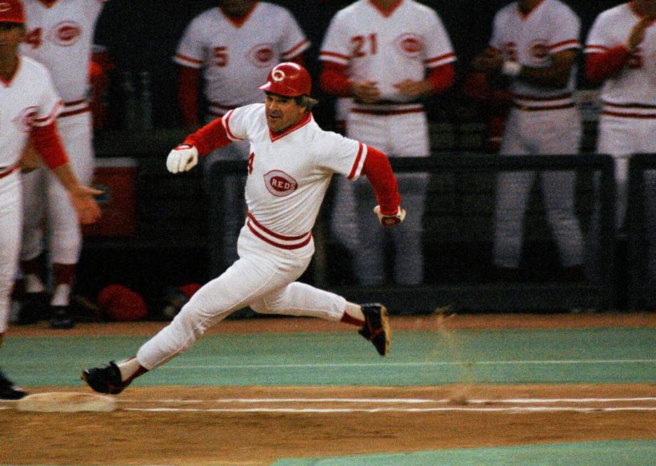 FILE - In this Sept. 11, 1985, file photo, Cincinnati Reds' Pete Rose rounds first base after h ...