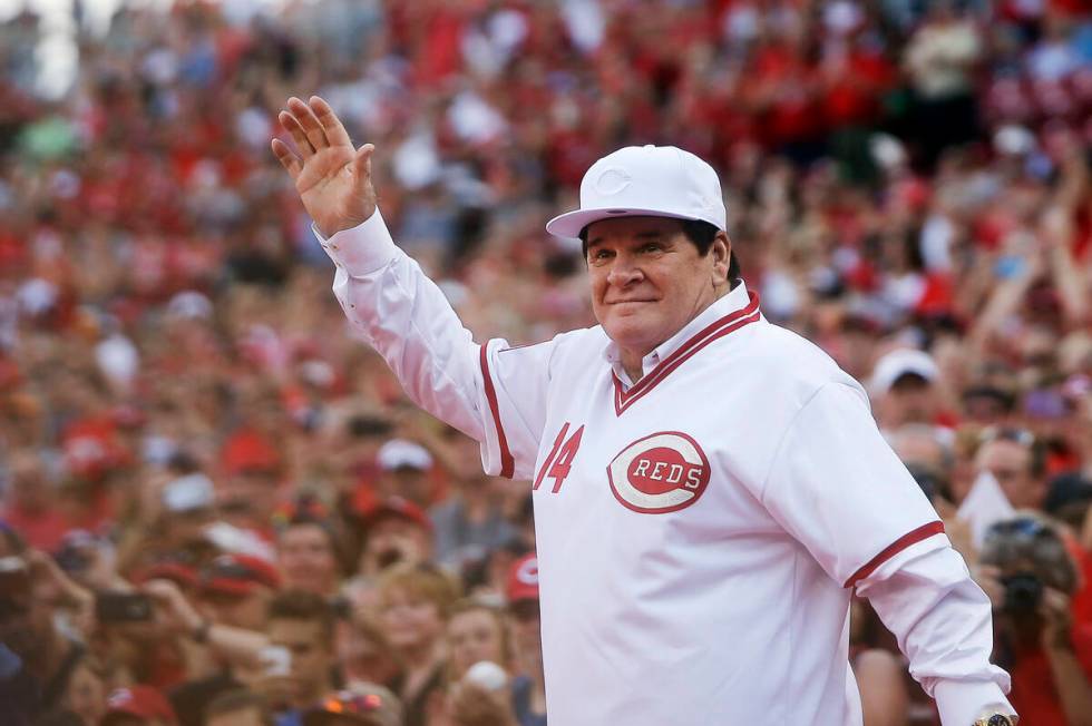 In this June 24, 2016, file photo, former Cincinnati Red Pete Rose waves to the crowd as he is ...