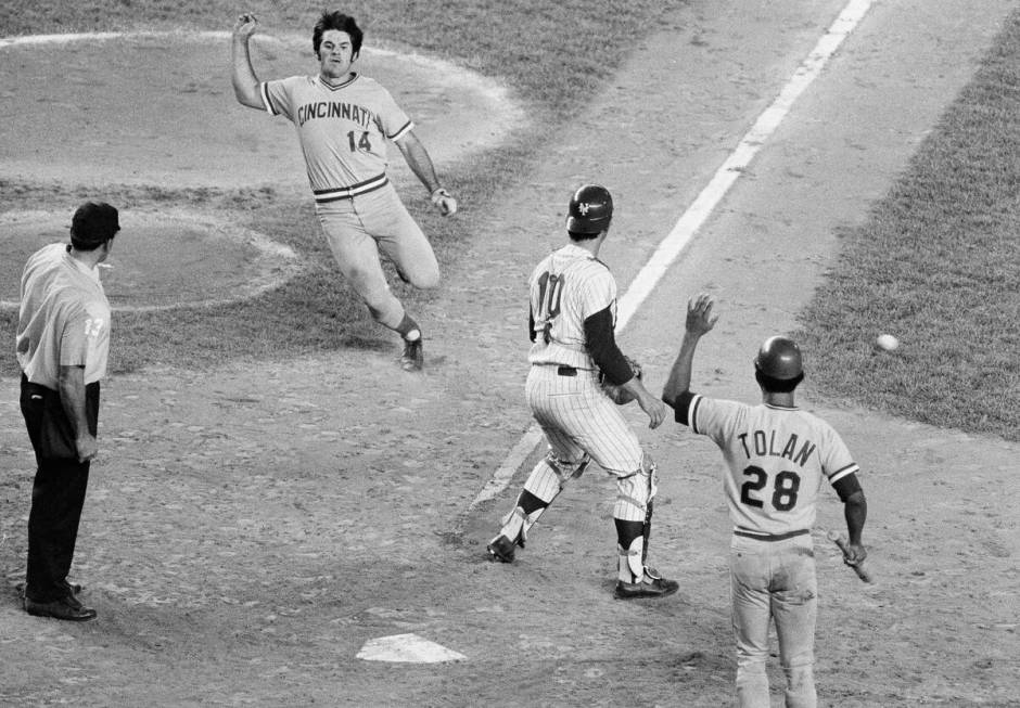 Cincinnati Reds' Pete Rose comes in from second for a score against the New York Mets in the ei ...