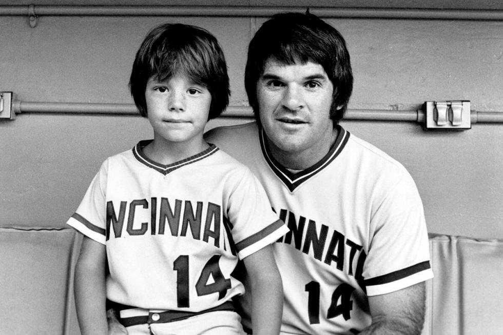 Cincinnati Reds player Pete Rose (14) poses with his son, Pete Rose Jr., at the All-Star game i ...