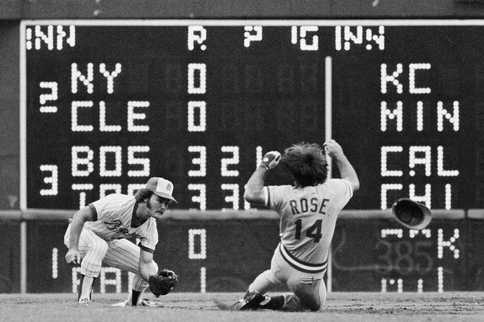 Cincinnati Reds Pete Rose attempts a steal at second base during the third inning against the ...