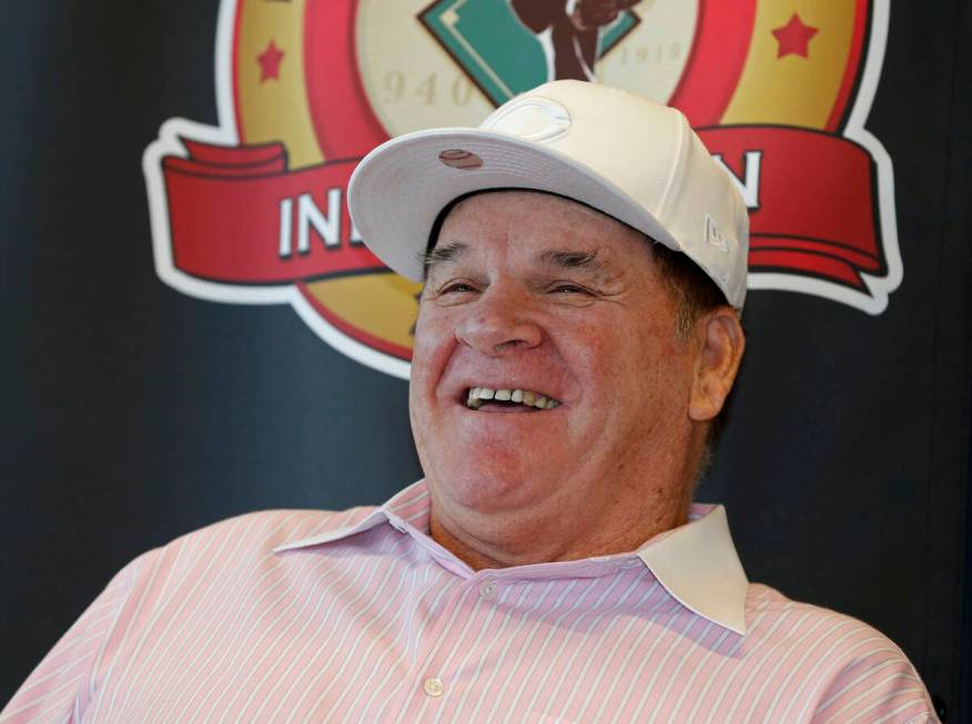 Former Cincinnati Reds player and manager Pete Rose, laughs during a press conference, where it ...