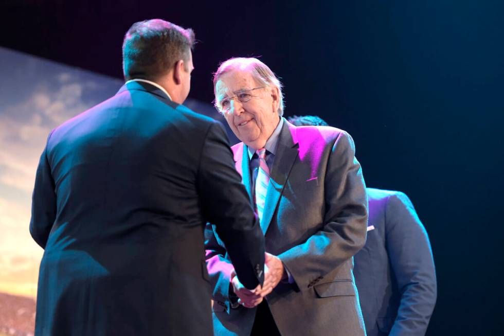 Broadcaster and Las Vegas Bowl Hall of Fame inductee Brent Musburger is greeted during a lunche ...