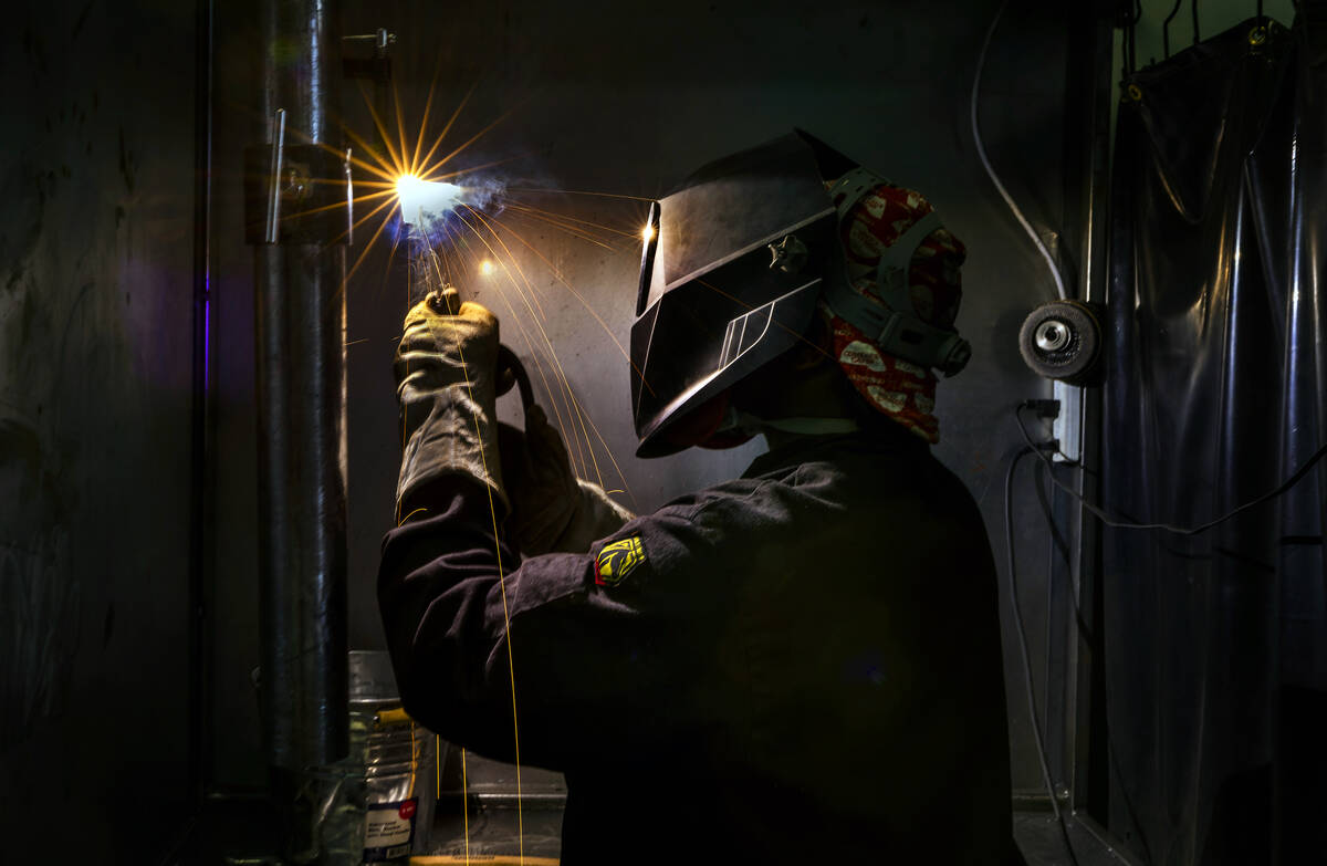 Graduate Pierre Leaks welds in one of the bays at the Welding School of Nevada on Friday, Sept. ...