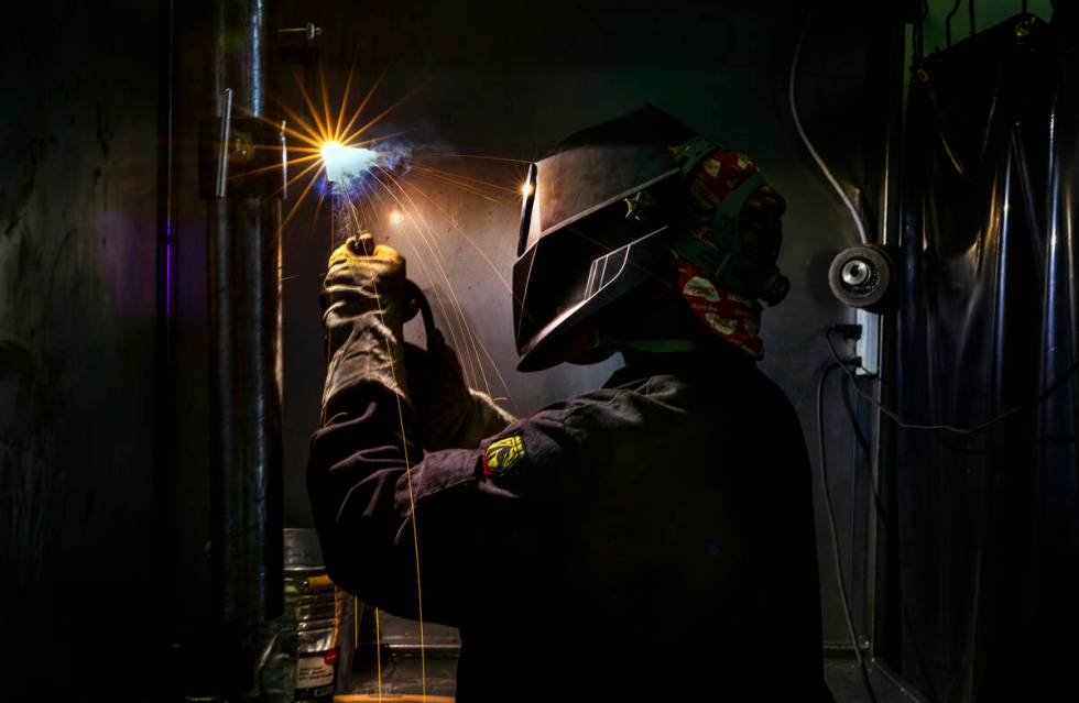 Graduate Pierre Leaks welds in one of the bays at the Welding School of Nevada on Friday, Sept. ...