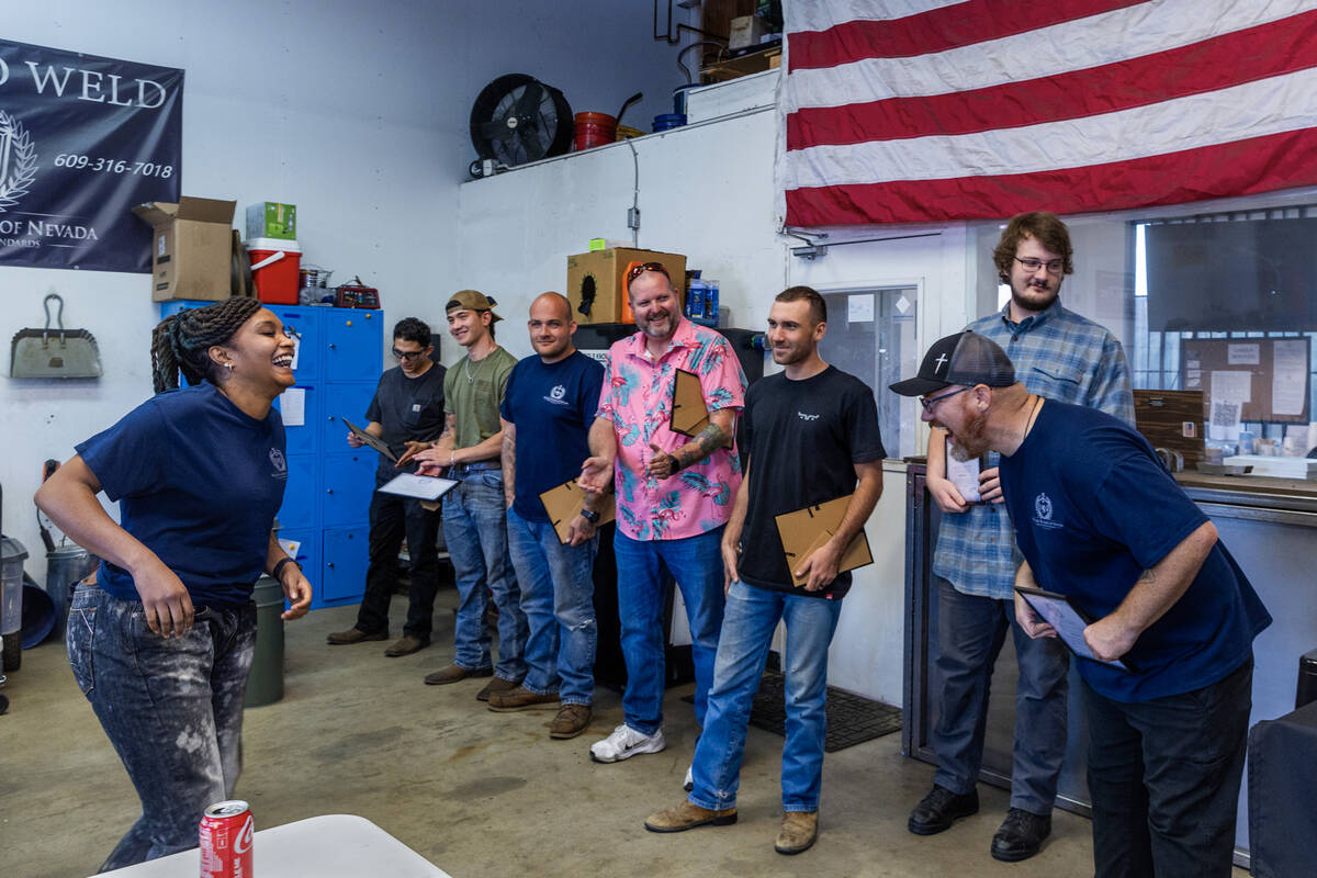 Founder Greg Gilbert, right, shares a laugh with instructor Raven Berrian during their graduati ...