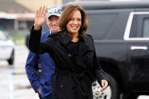 Democratic presidential nominee Vice President Kamala Harris smiles next to Sen. Mark Kelly, D- ...