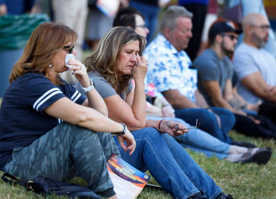 Angela Arriola, left, and Kathleen Spain weep as they attend the 1 October Sunrise Remembrance ...