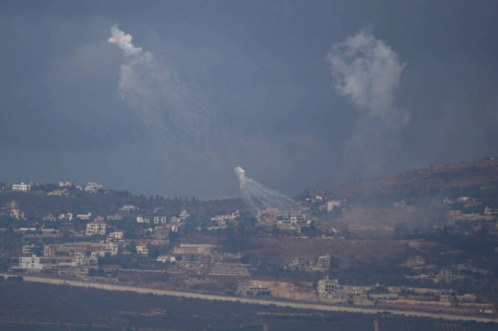 Israeli shelling hits an area in southern Lebanon as seen from northern Israel, Tuesday, Oct. 1 ...