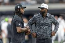 Raiders wide receiver Davante Adams, left, speaks with former Raiders wide receiver James Jones ...