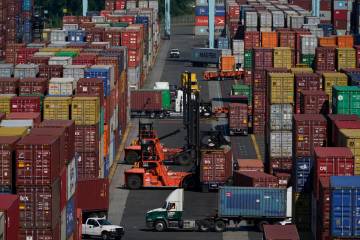 Containers are moved at the Port of New York and New Jersey in Elizabeth, N.J., on June 30, 202 ...