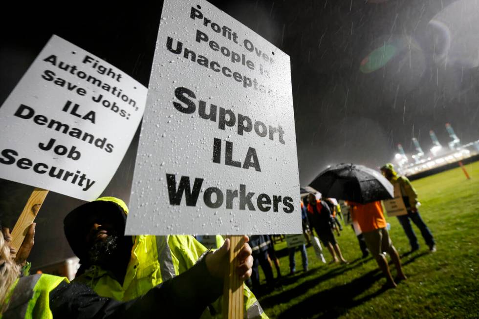 Hundreds of longshoremen strike together outside of the Virginia International Gateway in Ports ...