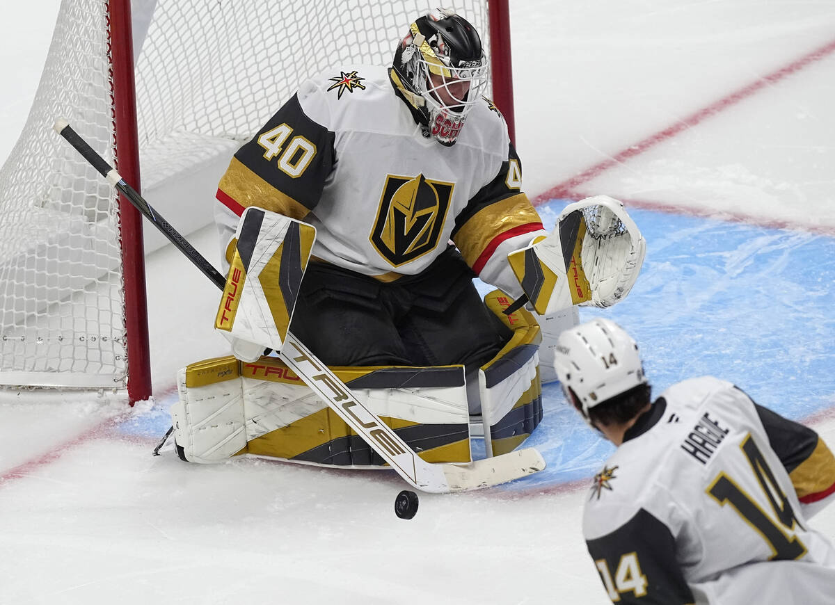 Vegas Golden Knights goalie Akira Schmid makes a stick save against the Colorado Avalanche in t ...