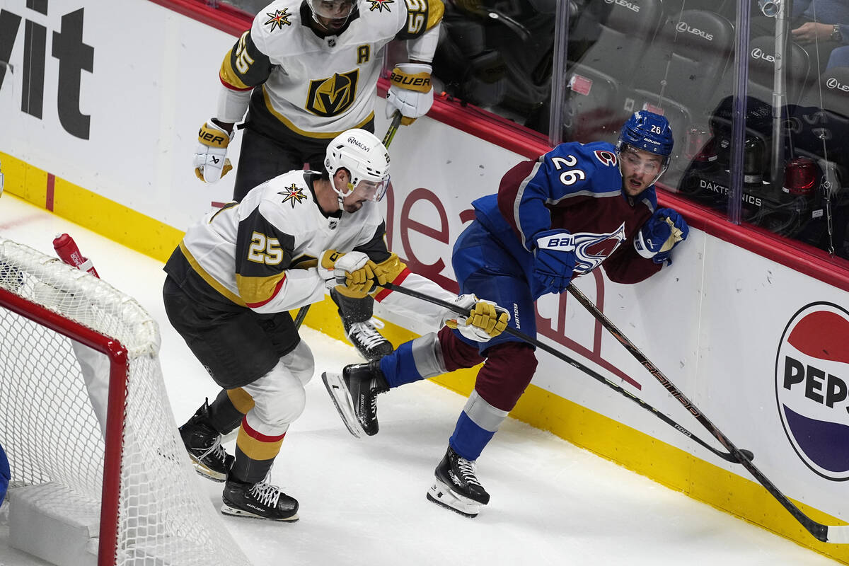 Vegas Golden Knights center Matyas Sapovaliv, left, pursues the puck with Colorado Avalanche de ...