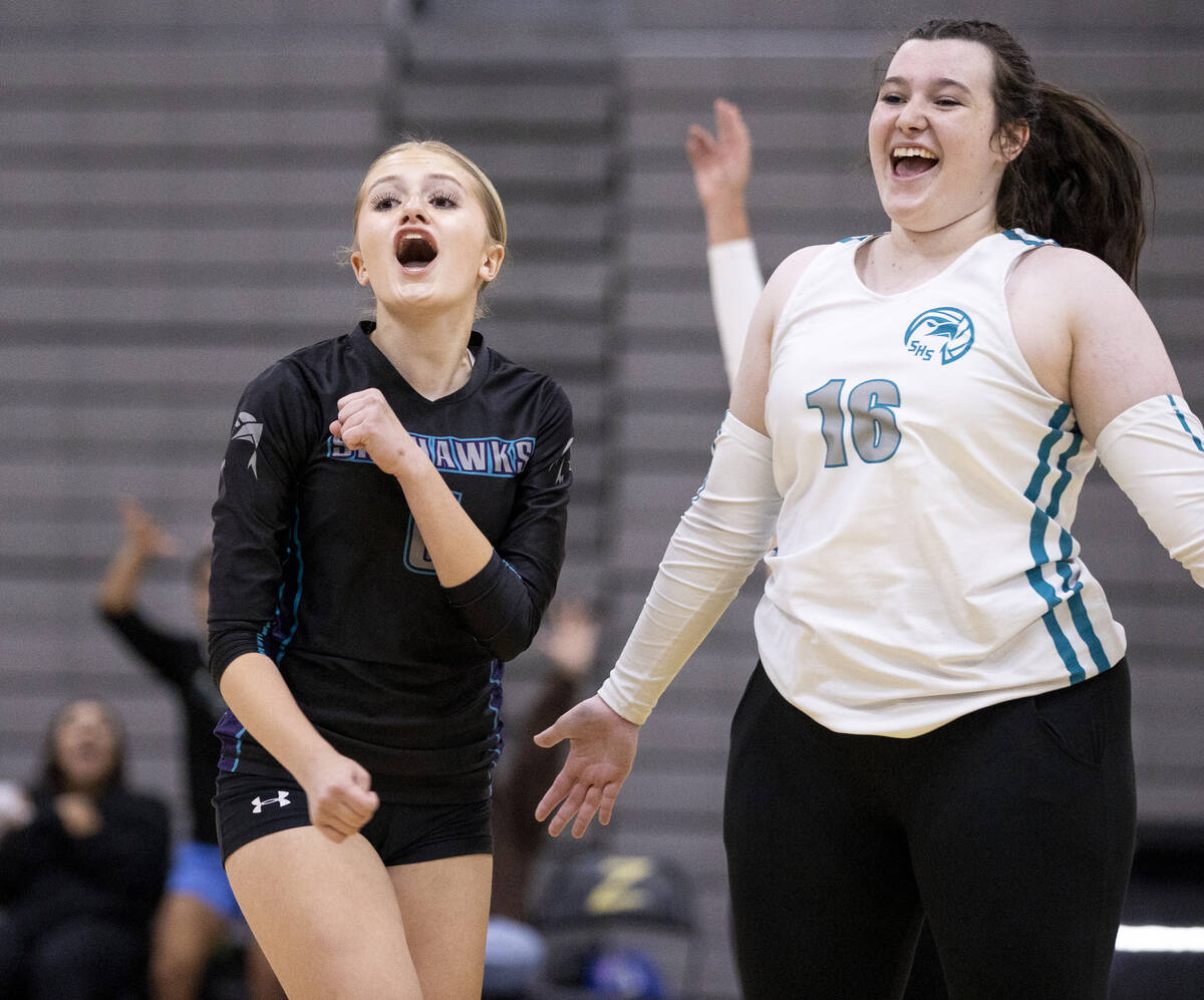 Silverado junior Xalia King (6) and junior Madison Smith (16) celebrate gaining a point during ...