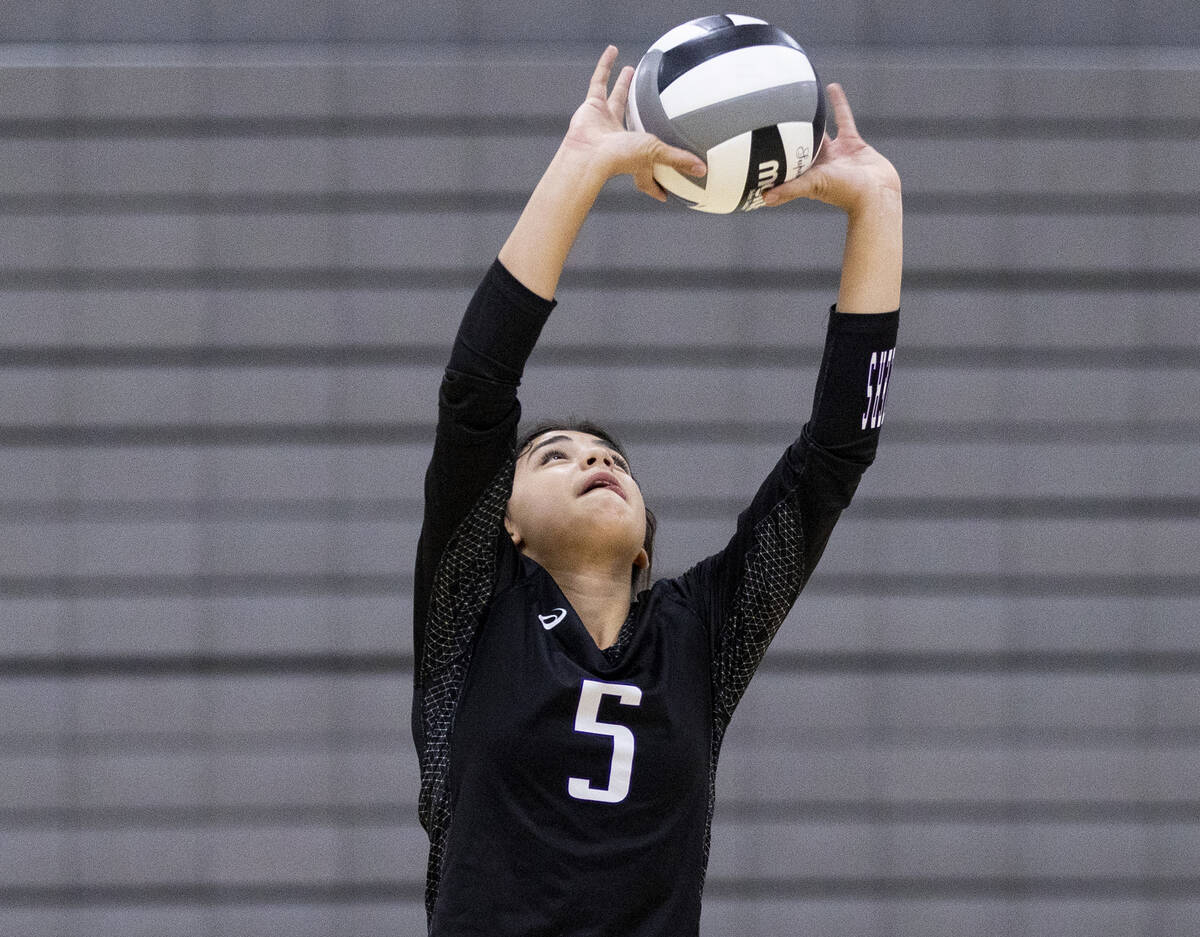 Durango junior Maya Dominguez (5) sets the ball during the high school volleyball game against ...