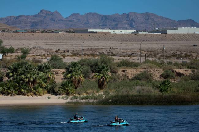 Jet skiiers navigate the Colorado River on Tuesday, Sept. 17, 2024, between Laughlin, Nevada an ...