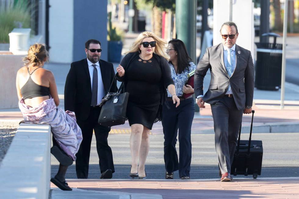 Former Las Vegas City Councilwoman Michele Fiore, center, arrives for her wire fraud trial at t ...