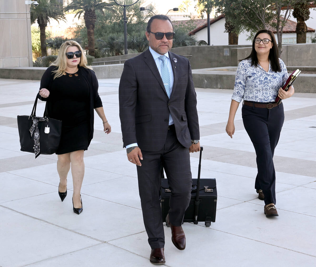 Former Las Vegas City Councilwoman Michele Fiore, left, arrives for her wire fraud trial at the ...