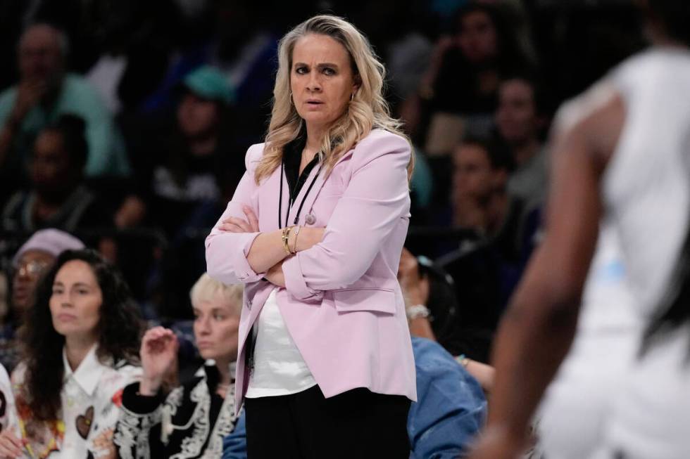 Las Vegas Aces head coach Becky Hammon watches during the first half of a WNBA basketball semif ...